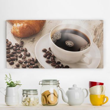 Obraz na płótnie - Parująca filiżanka do kawy z ziarnami kawy