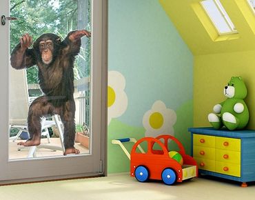 Naklejka na okno - Zadowolona małpa
