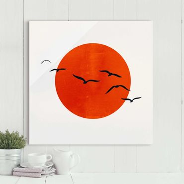 Obraz na szkle - Stado ptaków na tle czerwonego słońca I