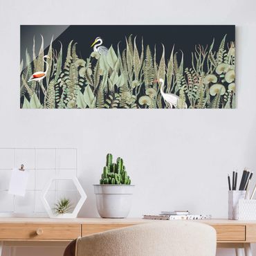 Obraz na szkle - Flamingo i bocian z roślinami na zielonym tle