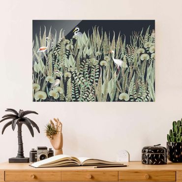 Obraz na szkle - Flamingo i bocian z roślinami na zielonym tle