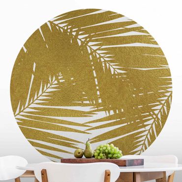 Okrągła tapeta samoprzylepna - Widok przez złote liście palmy