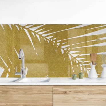 Panel ścienny do kuchni - Widok przez złote liście palmy
