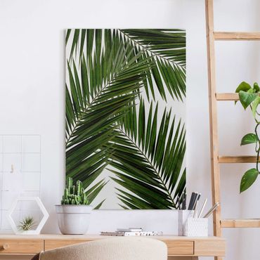 Obraz na płótnie - Widok przez zielone liście palmy