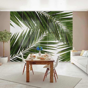 Zasłony panelowe zestaw - Widok przez zielone liście palmy