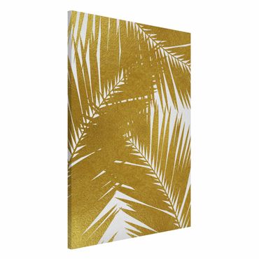 Tablica magnetyczna - Widok przez złote liście palmy