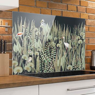Panel szklany do kuchni - Flamingo i bocian z roślinami na zielonym tle