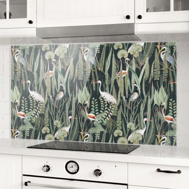 Panel szklany do kuchni - Flamingi i bociany z roślinami na zielonym tle