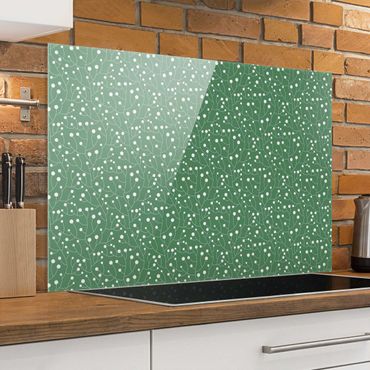 Panel szklany do kuchni - Naturalny wzrost wzoru z kropkami na zielonym tle