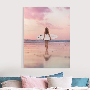 Obraz na płótnie - Surfer Girl With Board At Sunset - Format pionowy 3:4