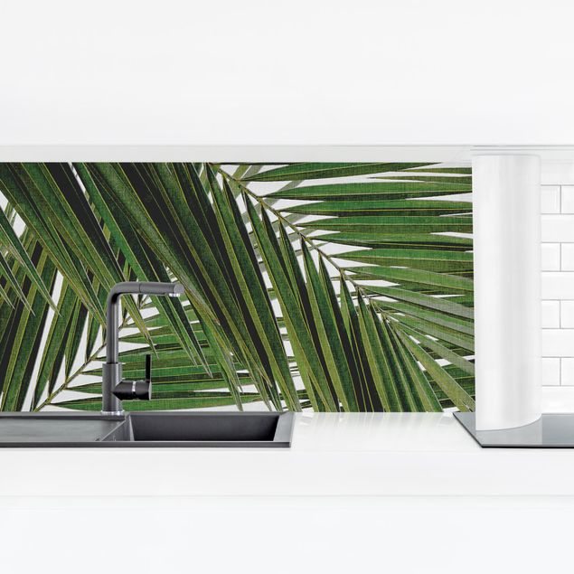 Panel ścienny do kuchni - Widok przez zielone liście palmy
