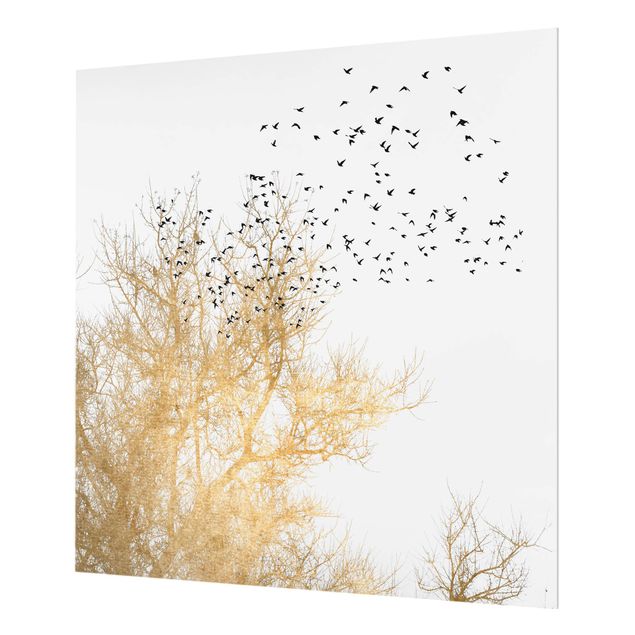 Panel szklany do kuchni - Stado ptaków na tle złotego drzewa