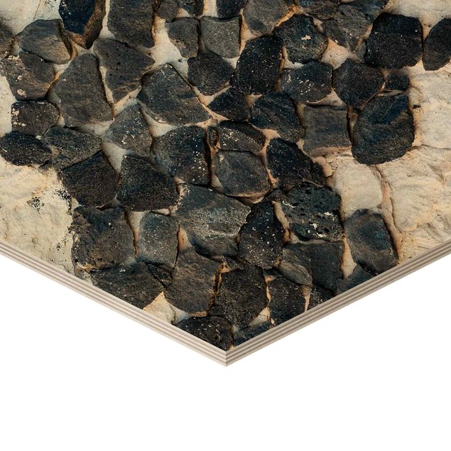 Obrazy drewniane Ściana z czarnymi kamieniami