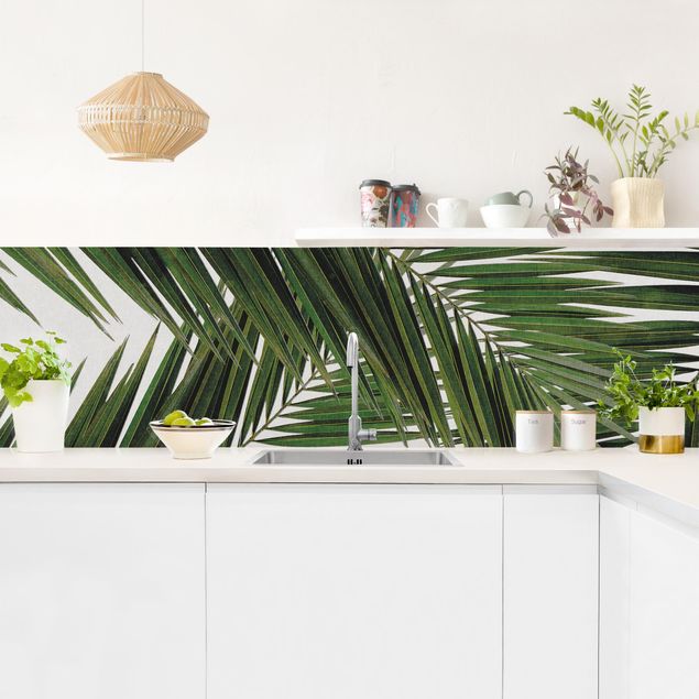 Panel ścienny do kuchni - Widok przez zielone liście palmy