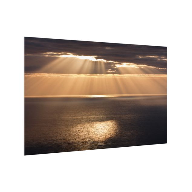 Panele szklane do kuchni Promienie słońca nad morzem