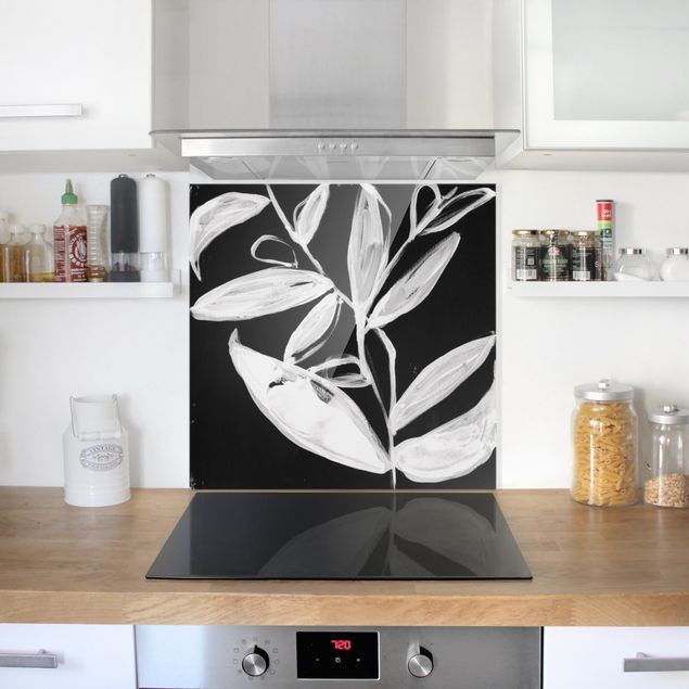 Panele szklane do kuchni Malowane liście na czarnym tle