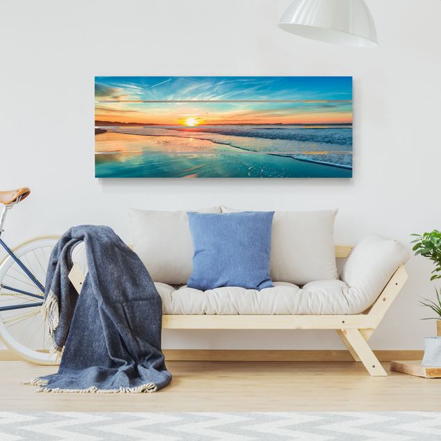 Obrazy na drewnie Romantyczny zachód słońca nad morzem
