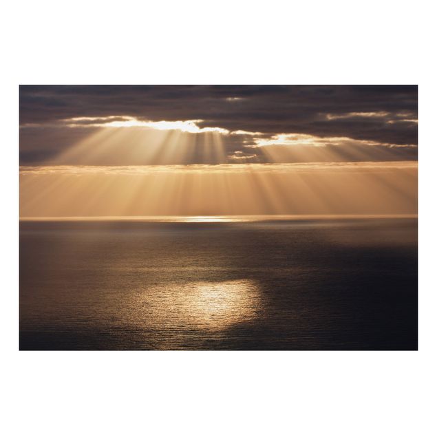 Nowoczesne obrazy do salonu Promienie słońca nad morzem