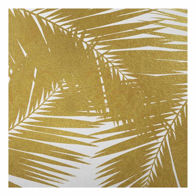 Obrazy do salonu Widok przez złote liście palmy