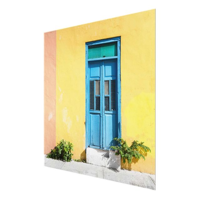 Obrazy na szkle kwadrat Kolorowa ściana Niebieskie drzwi