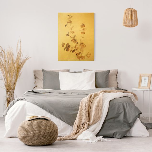 Obrazy do salonu nowoczesne Złote gałązki eukaliptusa z białymi liśćmi