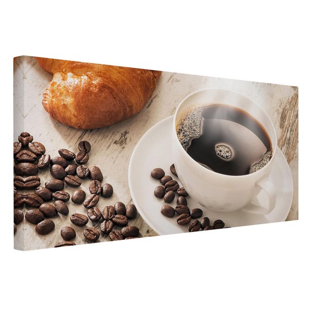 Obrazy na ścianę Parująca filiżanka do kawy z ziarnami kawy
