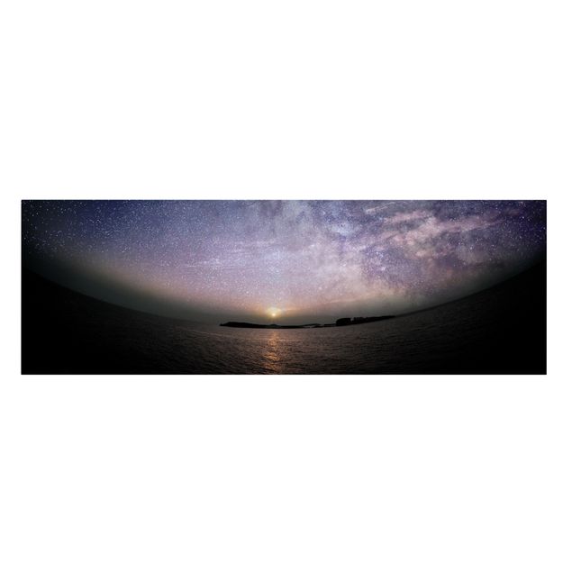 Obrazy na płótnie zachód słońca Słońce i rozgwieżdżone niebo nad morzem