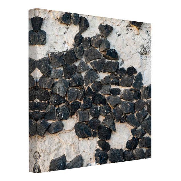 Obraz szary Ściana z czarnymi kamieniami