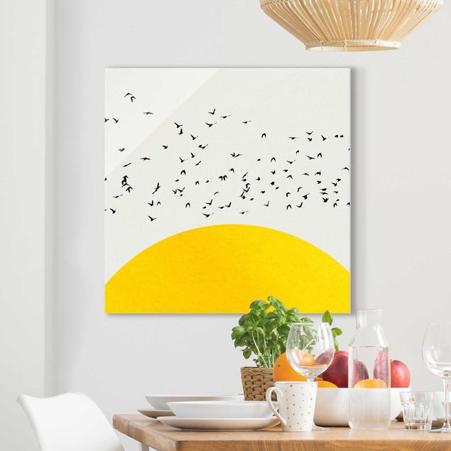 Obraz na szkle - Stado ptaków na tle żółtego słońca