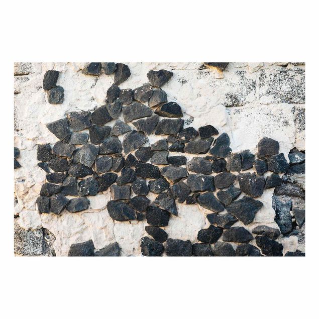 Obrazy artystów Ściana z czarnymi kamieniami