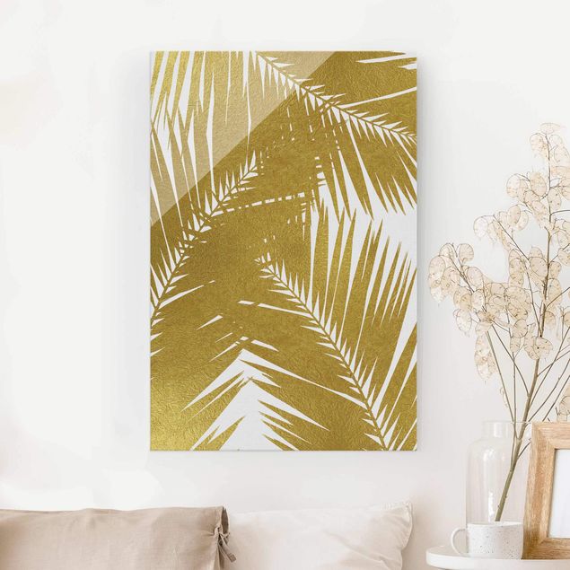 Dekoracja do kuchni Widok przez złote liście palmy