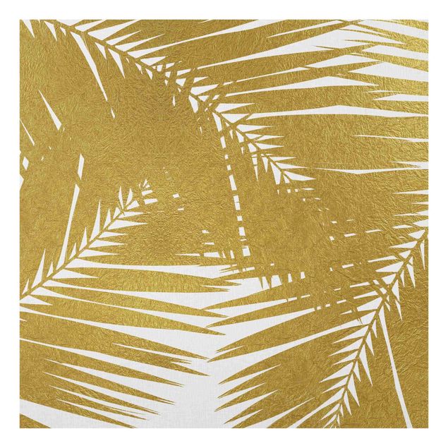 Nowoczesne obrazy Widok przez złote liście palmy