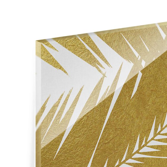 Obrazy z motywem kwiatowym Widok przez złote liście palmy
