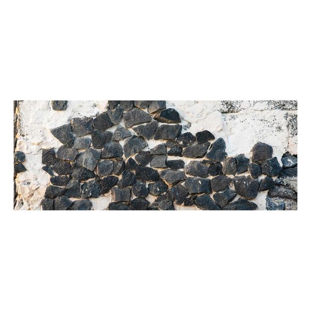 Obrazy artystów Ściana z czarnymi kamieniami