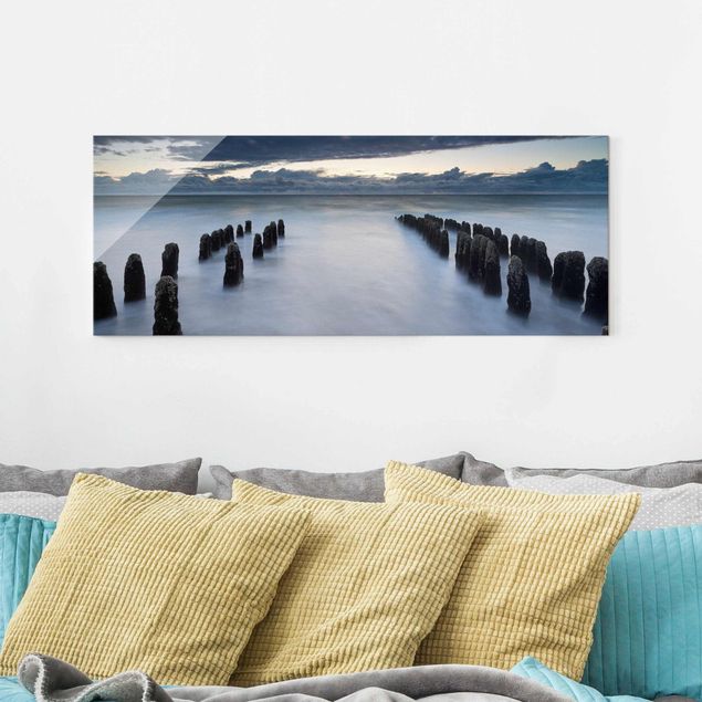 Obrazy na szkle panorama Drewniane groty na Morzu Północnym na wyspie Sylt