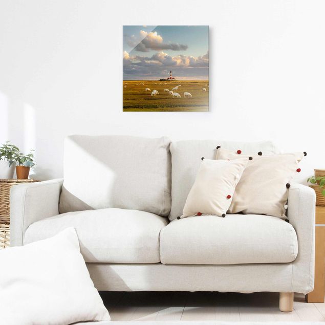 Obrazy na szkle wybrzeże Latarnia morska na Morzu Północnym ze stadem owiec