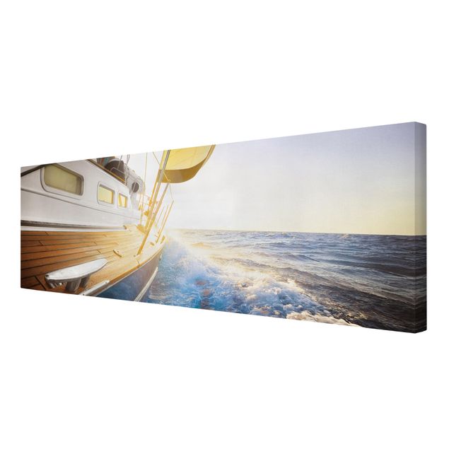 Obrazy na ścianę krajobrazy Żaglówka na błękitnym morzu w promieniach słońca