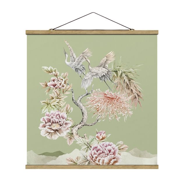 Obrazy ze zwierzętami Akwarela Bociany w locie z kwiatami na zielonym tle