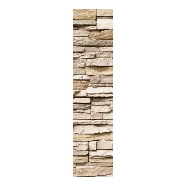 Domowe tekstylia Asian Kamienna ściana - kamienny mur z dużych jasnych kamieni.