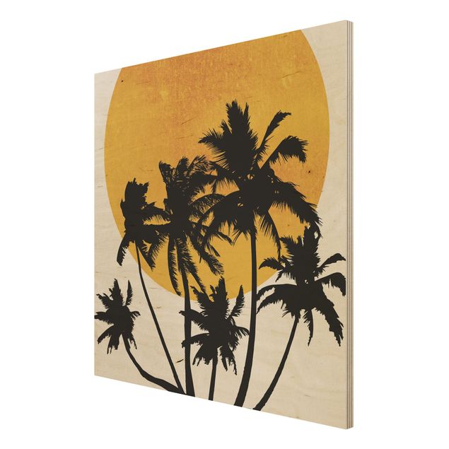 Obrazy na drewnie Palmy na tle złotego słońca