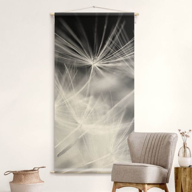 Obrazy nowoczesny Moving Dandelions Close Up On Black Background