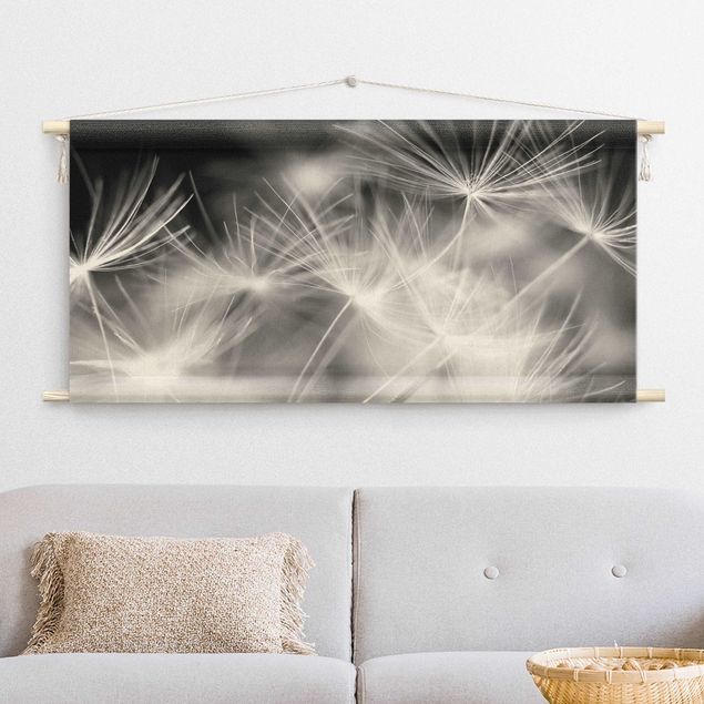 Obrazy nowoczesny Moving Dandelions Close Up On Black Background
