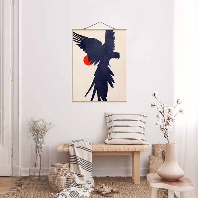 Obrazy nowoczesny Niebieska papuga na tle czerwonego słońca