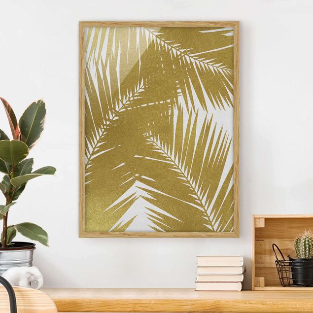 Obrazy w ramie krajobraz Widok przez złote liście palmy