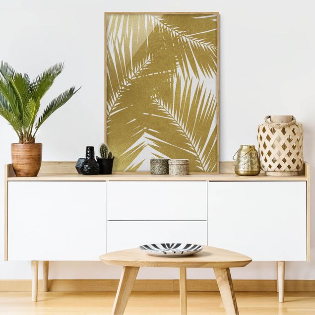 Obrazy w ramie do korytarzu Widok przez złote liście palmy