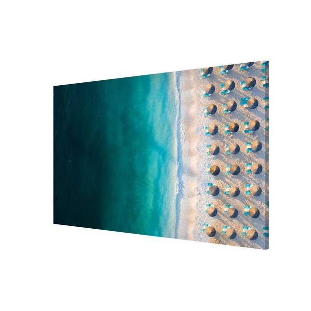 Obrazy nowoczesny Biała piaszczysta plaża z parasolami słomkowymi
