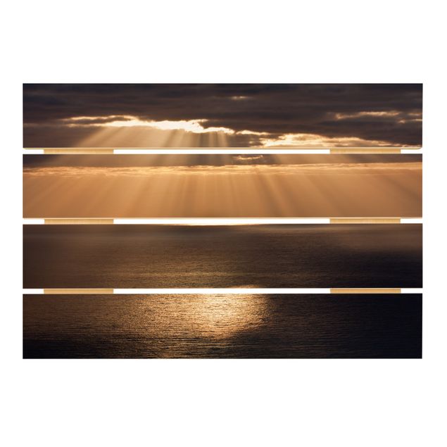 Obrazy na drewnie Promienie słońca nad morzem