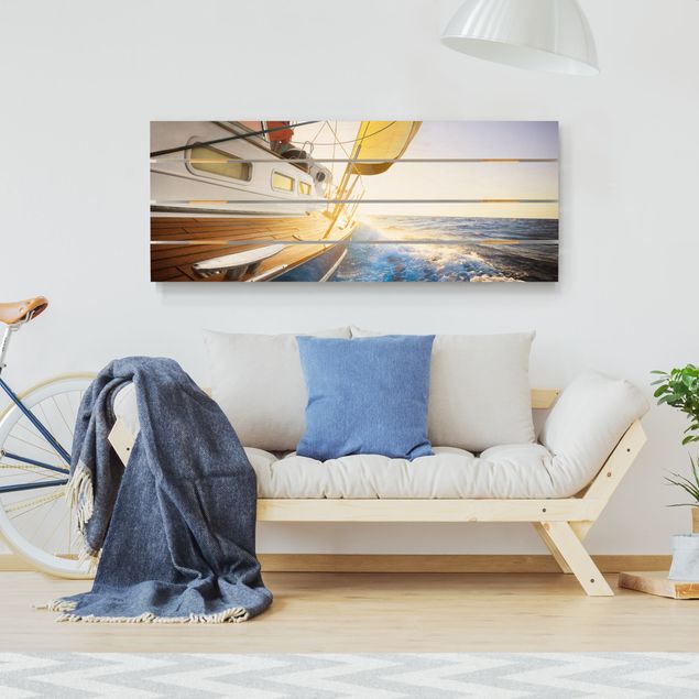 Obrazy na ścianę Żaglówka na błękitnym morzu w promieniach słońca