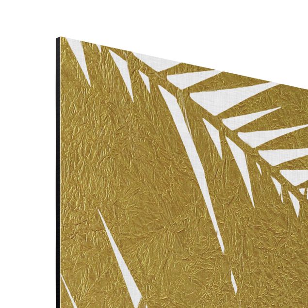 Obrazy kwiatowe Widok przez złote liście palmy