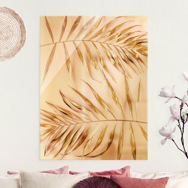 Obraz na szkle - Złote liście palmy na różowym tle